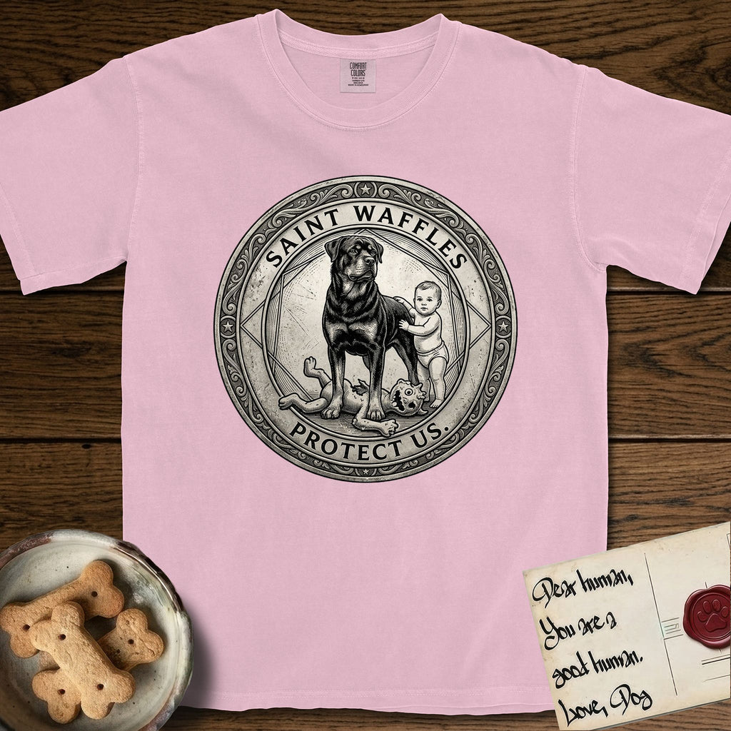 Patron Saint Medallion Saint Waffles T-Shirt flat lay in Blossom, featuring a vintage engraving coin medallion of a haloed Rottweiler standing guard over a small child, with the petition PROTECT US.