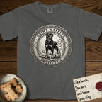 Patron Saint Medallion Saint Waffles T-Shirt flat lay in Pepper, featuring a vintage engraving coin medallion of a haloed Rottweiler standing guard over a small child, with the petition PROTECT US.