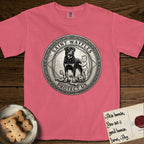 Patron Saint Medallion Saint Waffles T-Shirt flat lay in Watermelon, featuring a vintage engraving coin medallion of a haloed Rottweiler standing guard over a small child, with the petition PROTECT US.