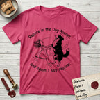 Rejoice in the Dog Bernese Mountain Dog T-Shirt flat lay in Heather Red, featuring a sparse pen-and-ink illustration of a girl and her Bernese Mountain Dog spinning together, her feet lifting off the ground.