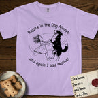Rejoice in the Dog Bernese Mountain Dog T-Shirt flat lay in Orchid, featuring a sparse pen-and-ink illustration of a girl and her Bernese Mountain Dog spinning together, her feet lifting off the ground.