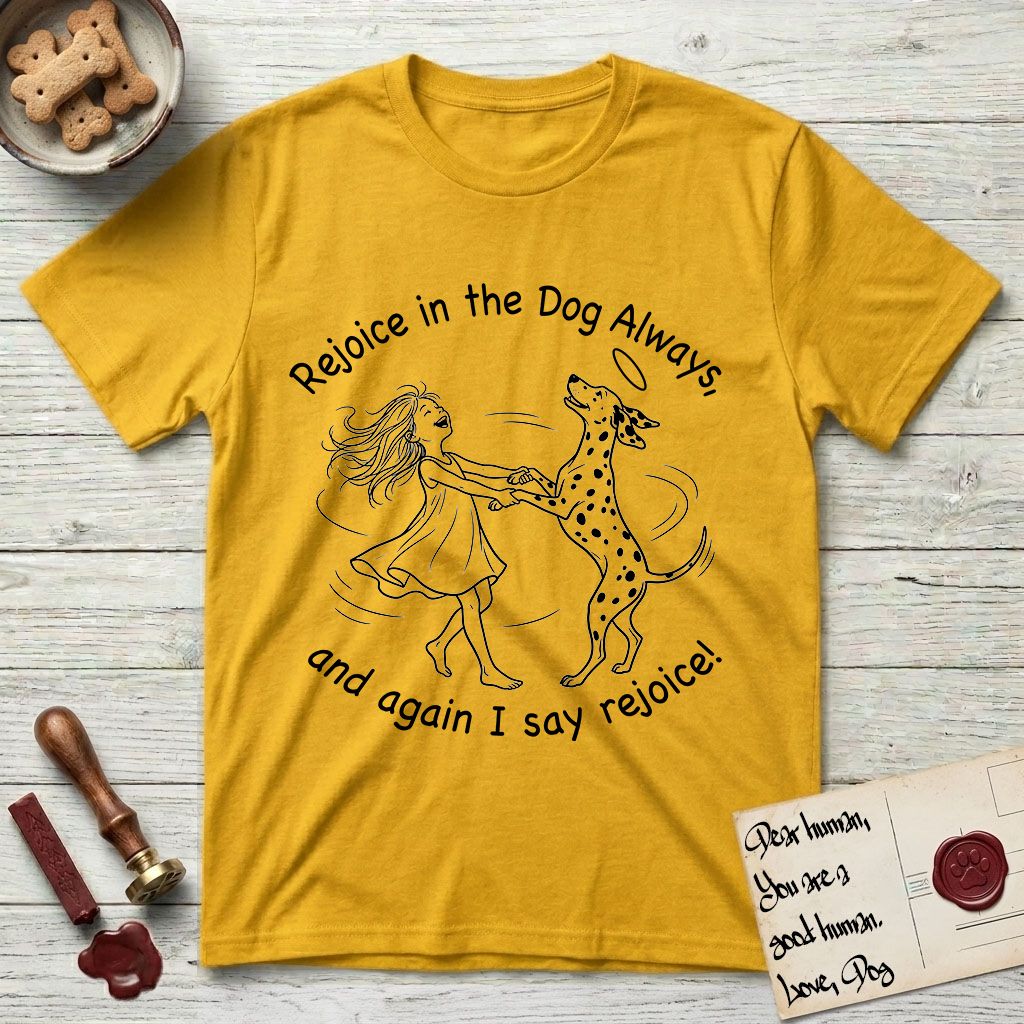Rejoice in the Dog Dalmatian T-Shirt flat lay in Daisy, featuring a sparse pen-and-ink illustration of a girl and her Dalmatian spinning together, both heads thrown back in joy.
