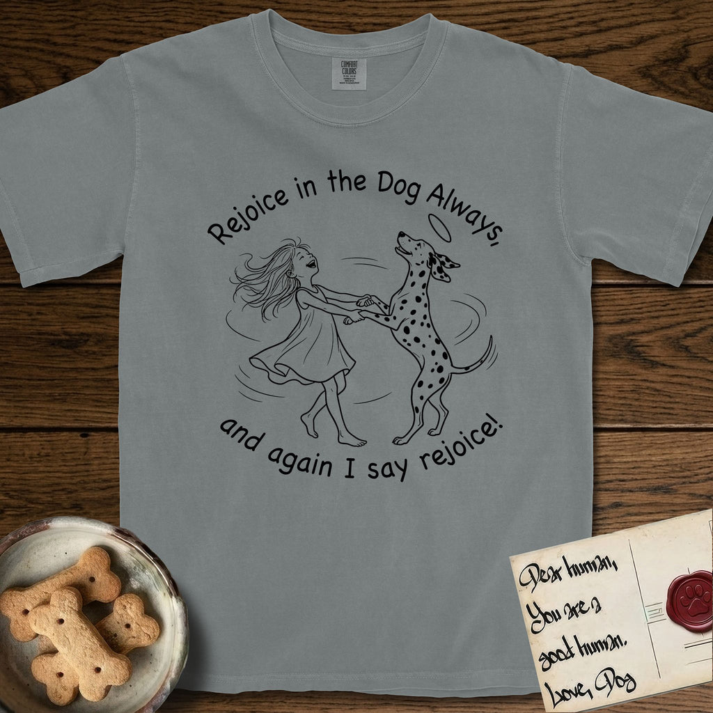 Rejoice in the Dog Dalmatian T-Shirt flat lay in Granite, featuring a sparse pen-and-ink illustration of a girl and her Dalmatian spinning together, both heads thrown back in joy.
