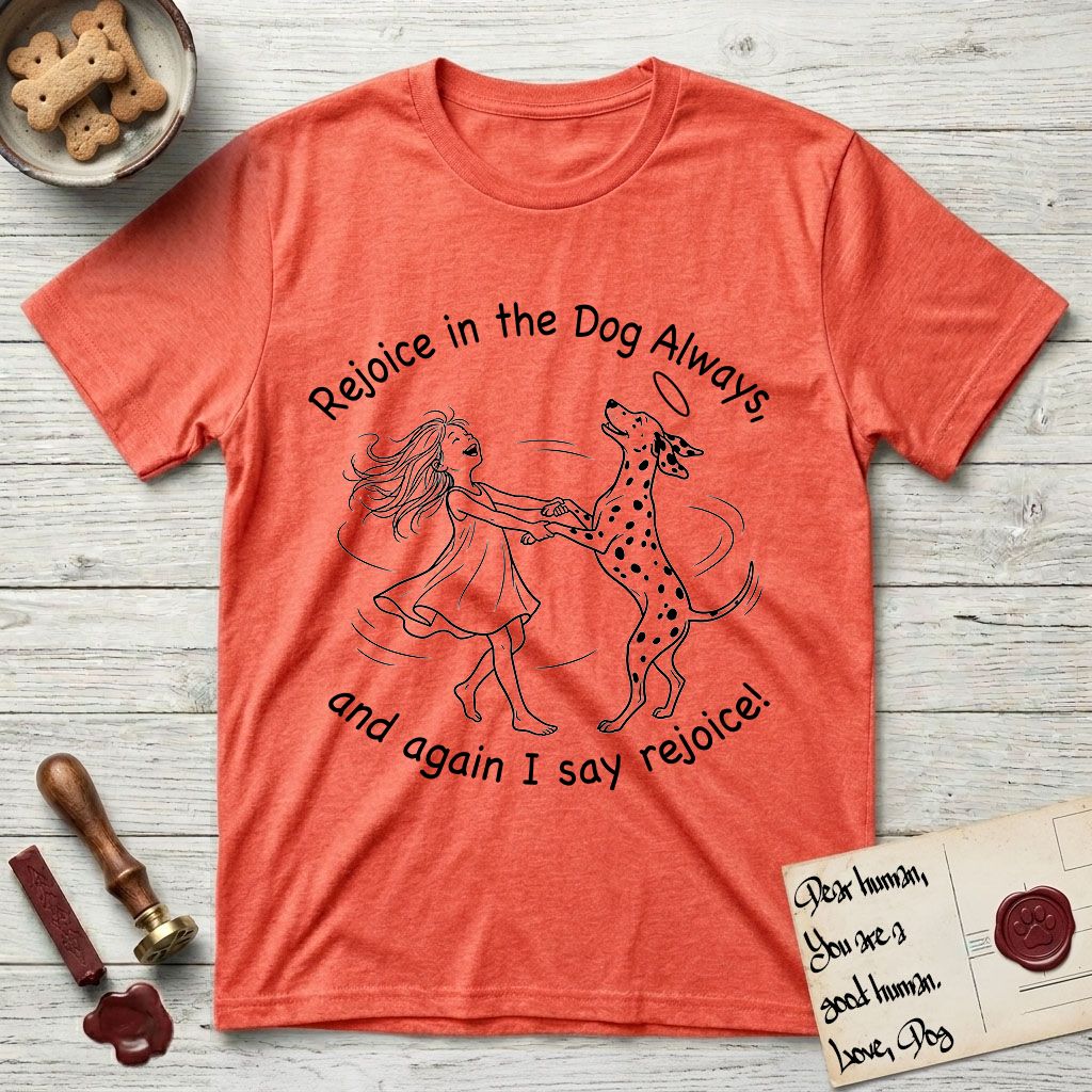 Rejoice in the Dog Dalmatian T-Shirt flat lay in Heather Orange, featuring a sparse pen-and-ink illustration of a girl and her Dalmatian spinning together, both heads thrown back in joy.