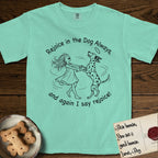 Rejoice in the Dog Dalmatian T-Shirt flat lay in Island Reef, featuring a sparse pen-and-ink illustration of a girl and her Dalmatian spinning together, both heads thrown back in joy.