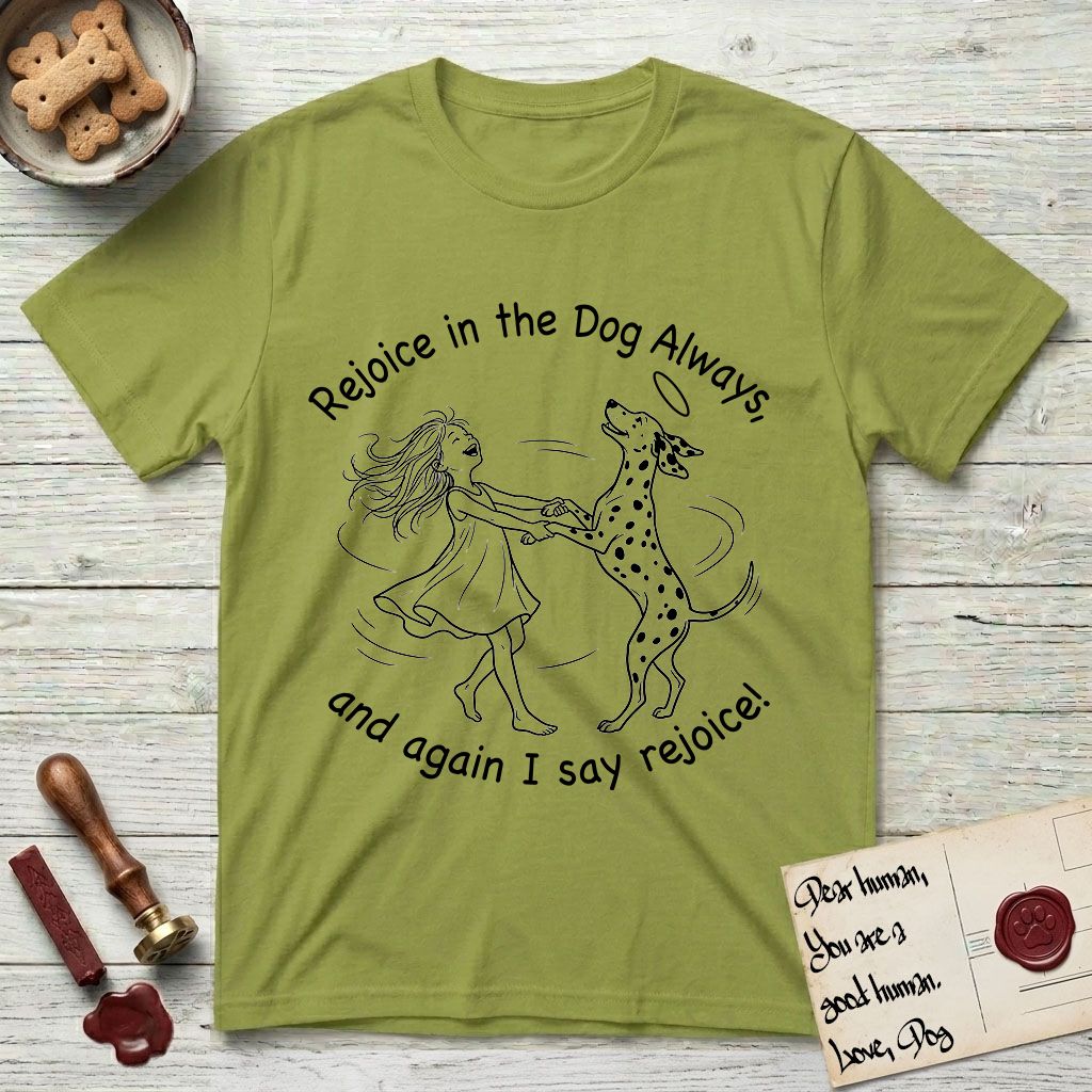 Rejoice in the Dog Dalmatian T-Shirt flat lay in Kiwi, featuring a sparse pen-and-ink illustration of a girl and her Dalmatian spinning together, both heads thrown back in joy.