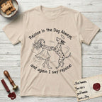 Rejoice in the Dog Dalmatian T-Shirt flat lay in Sand, featuring a sparse pen-and-ink illustration of a girl and her Dalmatian spinning together, both heads thrown back in joy.