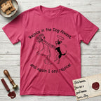 Rejoice in the Dog Lobo T-Shirt flat lay in Heather Red, featuring a sparse pen-and-ink illustration of a girl and her haloed Dog Lobo spinning together, hands and paws clasped.
