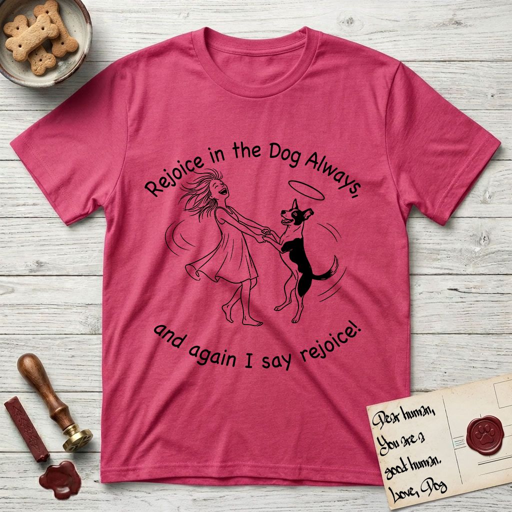 Rejoice in the Dog Lobo T-Shirt flat lay in Heather Red, featuring a sparse pen-and-ink illustration of a girl and her haloed Dog Lobo spinning together, hands and paws clasped.