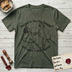 Rejoice in the Dog Rhodesian Ridgeback T-Shirt flat lay in Heather Military Green, featuring a sparse pen-and-ink illustration of a girl and her Rhodesian Ridgeback spinning together, hands and paws clasped.