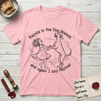 Rejoice in the Dog Rhodesian Ridgeback T-Shirt flat lay in Light Pink, featuring a sparse pen-and-ink illustration of a girl and her Rhodesian Ridgeback spinning together, hands and paws clasped.