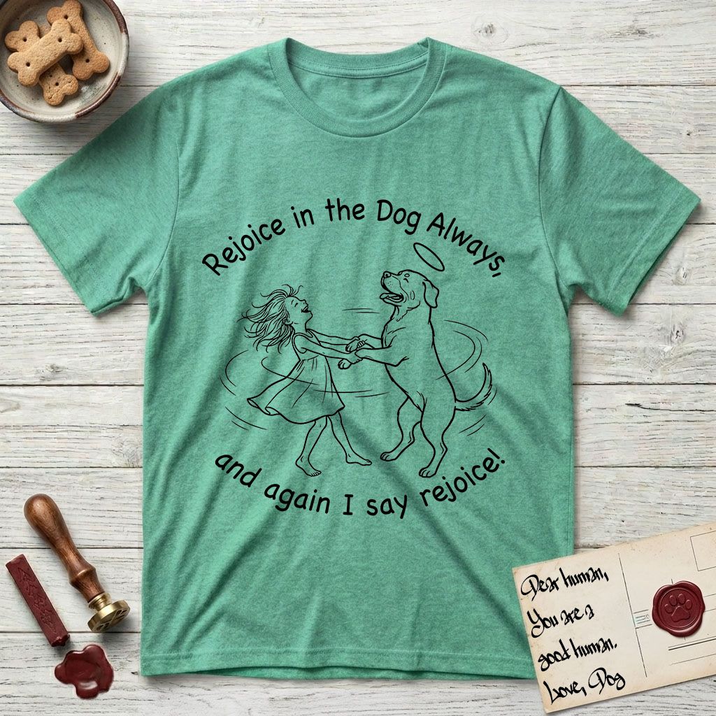 Rejoice in the Dog Rottweiler T-Shirt flat lay in Heather Irish Green, featuring a sparse pen-and-ink illustration of a girl and her Rottweiler dancing on her hind legs, both heads thrown back in joy.