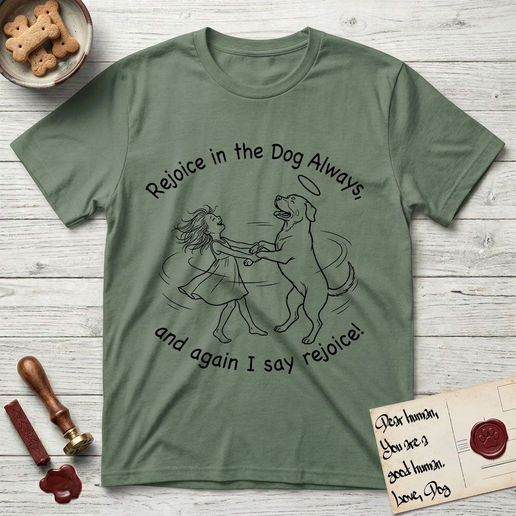 Rejoice in the Dog Rottweiler T-Shirt flat lay in Military Green, featuring a sparse pen-and-ink illustration of a girl and her Rottweiler dancing on her hind legs, both heads thrown back in joy.