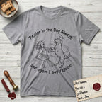 Rejoice in the Dog Rottweiler T-Shirt flat lay in Sport Grey, featuring a sparse pen-and-ink illustration of a girl and her Rottweiler dancing on her hind legs, both heads thrown back in joy.