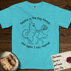Rejoice in the Dog Samoyed T-Shirt flat lay in Lagoon Blue, featuring a sparse pen-and-ink illustration of a girl and her smiling Samoyed spinning together, hands and paws clasped.