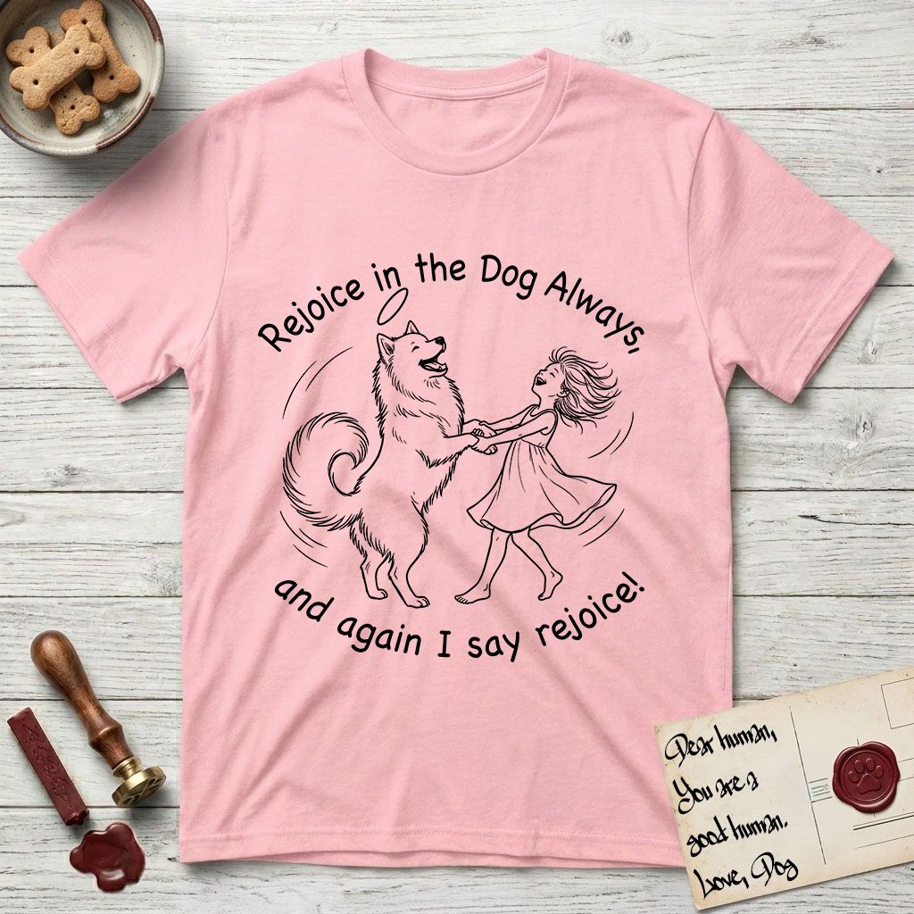 Rejoice in the Dog Samoyed T-Shirt flat lay in Light Pink, featuring a sparse pen-and-ink illustration of a girl and her smiling Samoyed spinning together, hands and paws clasped.