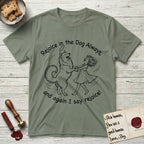 Rejoice in the Dog Samoyed T-Shirt flat lay in Sage, featuring a sparse pen-and-ink illustration of a girl and her smiling Samoyed spinning together, hands and paws clasped.