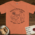 Rejoice in the Dog Vizsla T-Shirt flat lay in Melon, featuring a sparse pen-and-ink illustration of a girl and her Vizsla spinning together, hands and paws clasped.