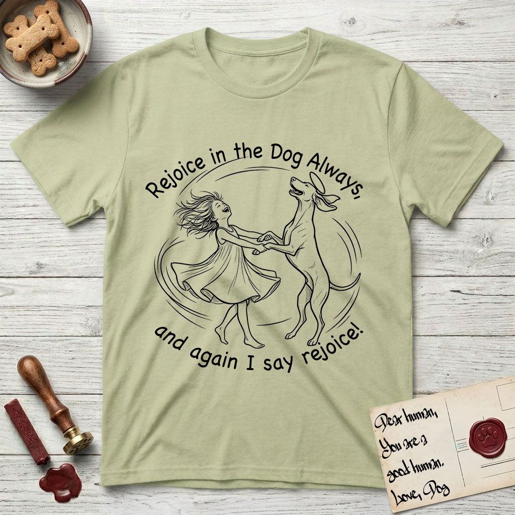 Rejoice in the Dog Vizsla T-Shirt flat lay in Pistachio, featuring a sparse pen-and-ink illustration of a girl and her Vizsla spinning together, hands and paws clasped.