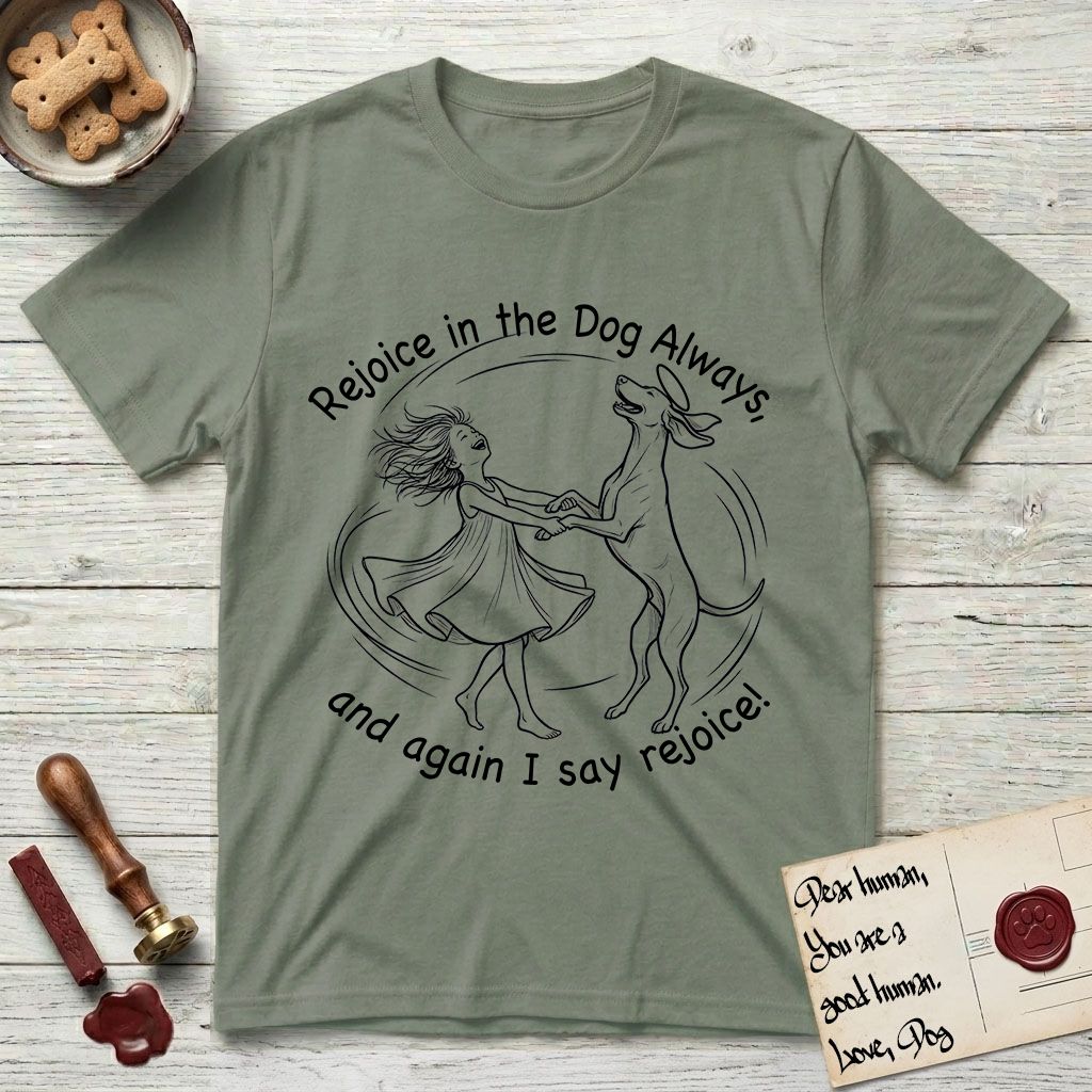 Rejoice in the Dog Vizsla T-Shirt flat lay in Sage, featuring a sparse pen-and-ink illustration of a girl and her Vizsla spinning together, hands and paws clasped.