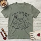 Rejoice in the Dog Vizsla T-Shirt flat lay in Sage, featuring a sparse pen-and-ink illustration of a girl and her Vizsla spinning together, hands and paws clasped.