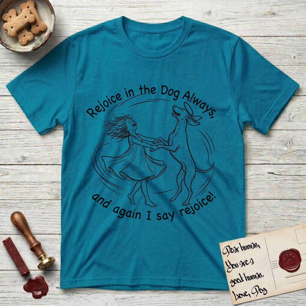 Rejoice in the Dog Vizsla T-Shirt flat lay in Tropical Blue, featuring a sparse pen-and-ink illustration of a girl and her Vizsla spinning together, hands and paws clasped.