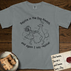 Rejoice in the Dog Whippet T-Shirt flat lay in Granite, featuring a sparse pen-and-ink illustration of a girl and her Whippet dancing on his hind legs, both heads thrown back in joy.