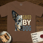 Saved by Dog Australian Cattle Dog T-Shirt flat lay in Espresso, featuring half an Australian Cattle Dog's face in distressed vintage screen print, blue-speckled with tan points and one amber eye, cropped down the centerline beside bold stacked block lettering.