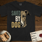 Saved by Dog Galgo T-Shirt flat lay in Black, featuring half a brindle Galgo's face in distressed vintage screen print, a folded rose ear and a gentle eye, cropped down the centerline beside bold stacked block lettering.