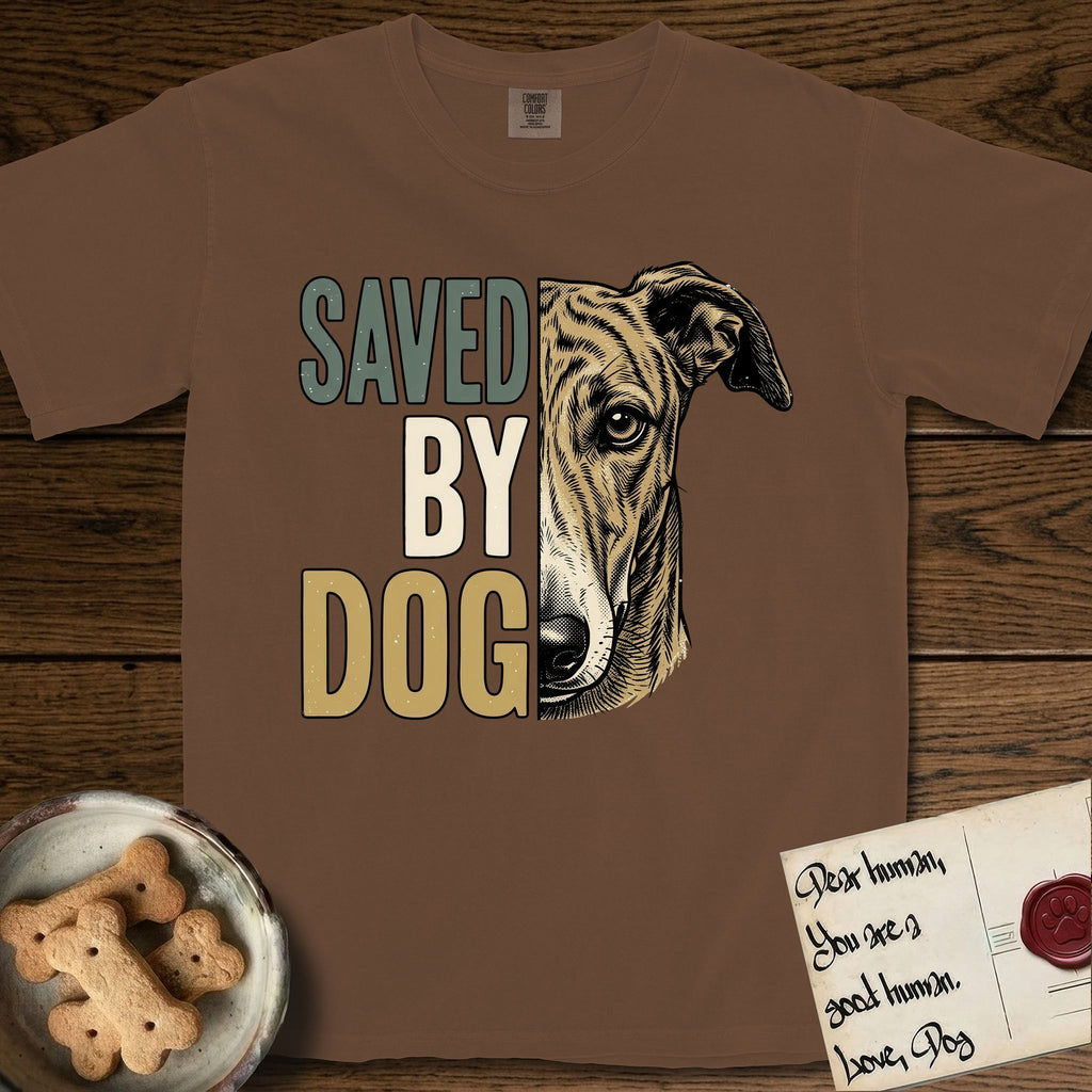 Saved by Dog Galgo T-Shirt flat lay in Espresso, featuring half a brindle Galgo's face in distressed vintage screen print, a folded rose ear and a gentle eye, cropped down the centerline beside bold stacked block lettering.