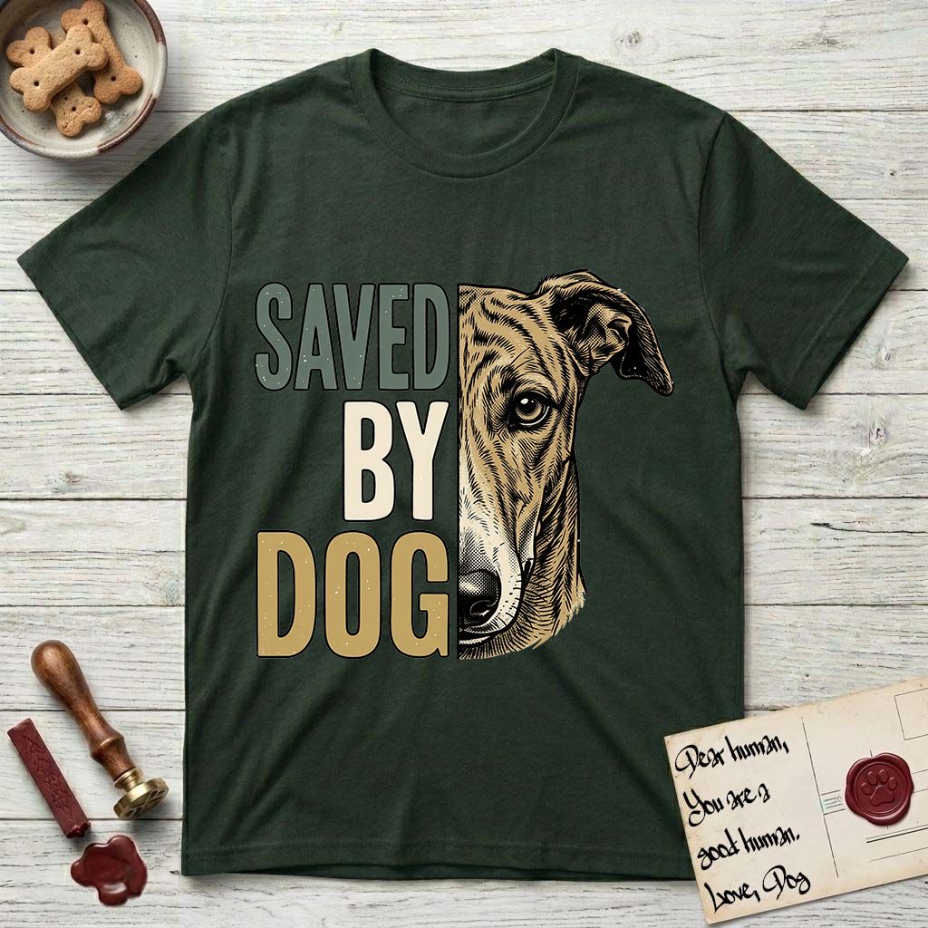 Saved by Dog Galgo T-Shirt flat lay in Forest Green, featuring half a brindle Galgo's face in distressed vintage screen print, a folded rose ear and a gentle eye, cropped down the centerline beside bold stacked block lettering.