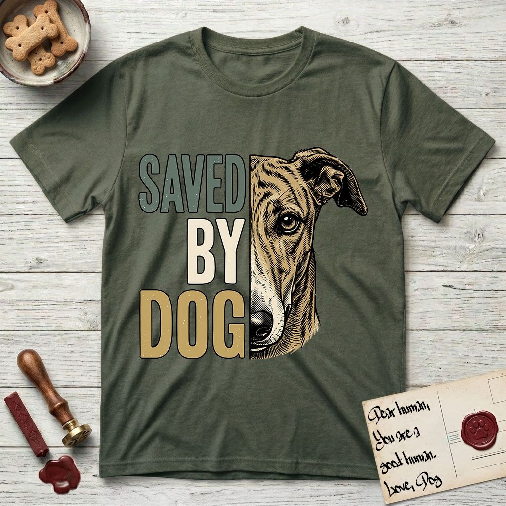 Saved by Dog Galgo T-Shirt flat lay in Heather Military Green, featuring half a brindle Galgo's face in distressed vintage screen print, a folded rose ear and a gentle eye, cropped down the centerline beside bold stacked block lettering.