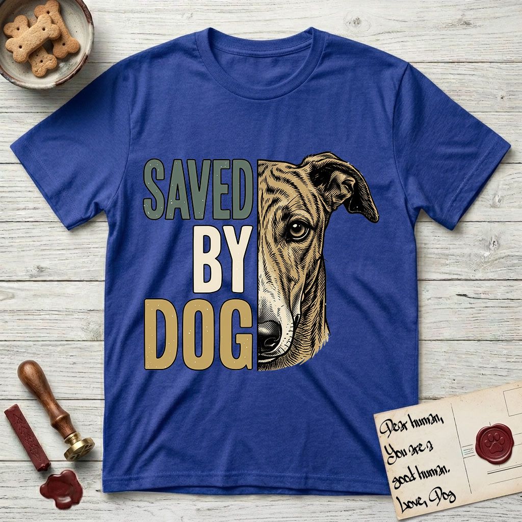 Saved by Dog Galgo T-Shirt flat lay in Heather Royal, featuring half a brindle Galgo's face in distressed vintage screen print, a folded rose ear and a gentle eye, cropped down the centerline beside bold stacked block lettering.
