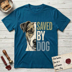 Saved by Dog Jack Russell T-Shirt flat lay in Antique Sapphire, featuring half a tan-and-white Jack Russell's face in distressed vintage screen print, a folded ear with a dark patch and forward whiskers, cropped down the centerline beside bold stacked block lettering.