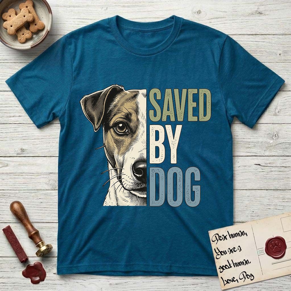 Saved by Dog Jack Russell T-Shirt flat lay in Antique Sapphire, featuring half a tan-and-white Jack Russell's face in distressed vintage screen print, a folded ear with a dark patch and forward whiskers, cropped down the centerline beside bold stacked block lettering.