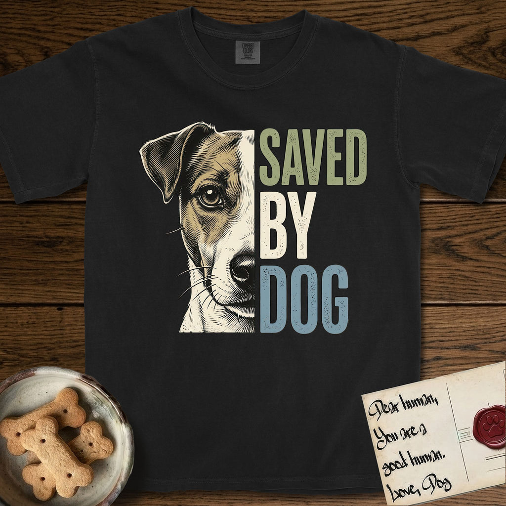 Saved by Dog Jack Russell T-Shirt flat lay in Black, featuring half a tan-and-white Jack Russell's face in distressed vintage screen print, a folded ear with a dark patch and forward whiskers, cropped down the centerline beside bold stacked block lettering.
