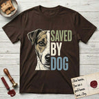 Saved by Dog Jack Russell T-Shirt flat lay in Dark Chocolate, featuring half a tan-and-white Jack Russell's face in distressed vintage screen print, a folded ear with a dark patch and forward whiskers, cropped down the centerline beside bold stacked block lettering.
