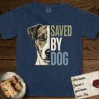 Saved by Dog Jack Russell T-Shirt flat lay in True Navy, featuring half a tan-and-white Jack Russell's face in distressed vintage screen print, a folded ear with a dark patch and forward whiskers, cropped down the centerline beside bold stacked block lettering.