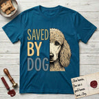 Saved by Dog Poodle T-Shirt flat lay in Antique Sapphire, featuring half an apricot Poodle's face in distressed vintage screen print, soft natural curls and a knowing eye, cropped down the centerline beside bold stacked block lettering.
