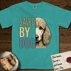 Saved by Dog Poodle T-Shirt flat lay in Seafoam, featuring half an apricot Poodle's face in distressed vintage screen print, soft natural curls and a knowing eye, cropped down the centerline beside bold stacked block lettering.