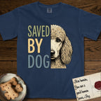 Saved by Dog Poodle T-Shirt flat lay in True Navy, featuring half an apricot Poodle's face in distressed vintage screen print, soft natural curls and a knowing eye, cropped down the centerline beside bold stacked block lettering.