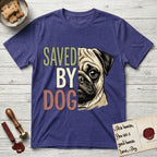 Saved by Dog Pug T-Shirt flat lay in Metro Blue, featuring half a fawn Pug's face in distressed vintage screen print, a dark mask and one large round eye, cropped down the centerline beside bold stacked block lettering.