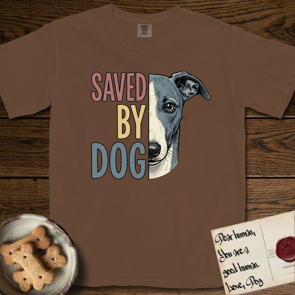 Saved by Dog Whippet T-Shirt flat lay in Espresso, featuring half a blue-grey Whippet's face in distressed vintage screen print, a folded rose ear and a large liquid eye, cropped down the centerline beside bold stacked block lettering.