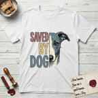 Saved by Dog Whippet T-Shirt flat lay in White, featuring half a blue-grey Whippet's face in distressed vintage screen print, a folded rose ear and a large liquid eye, cropped down the centerline beside bold stacked block lettering.