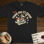 Thank Dog It's Friday T-Shirt flat lay in Black, featuring a retro 1930s cartoon of a Dog bursting through a Friday calendar page, surrounded by musical notes, stars, and a clock, with retro display lettering reading TDIF.