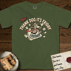 Thank Dog It's Friday T-Shirt flat lay in Hemp, featuring a retro 1930s cartoon of a Dog bursting through a Friday calendar page, surrounded by musical notes, stars, and a clock, with retro display lettering reading TDIF.