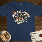 Thank Dog It's Friday T-Shirt flat lay in True Navy, featuring a retro 1930s cartoon of a Dog bursting through a Friday calendar page, surrounded by musical notes, stars, and a clock, with retro display lettering reading TDIF.