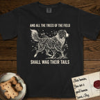 Trees of the Field Australian Shepherd T-Shirt flat lay in Black, featuring a vintage woodcut illustration of an Australian Shepherd formed of flowering cherry branches, mid-stride, with the words And All the Trees of the Field Shall Wag Their Tails.