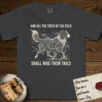 Trees of the Field Australian Shepherd T-Shirt flat lay in Graphite, featuring a vintage woodcut illustration of an Australian Shepherd formed of flowering cherry branches, mid-stride, with the words And All the Trees of the Field Shall Wag Their Tails.
