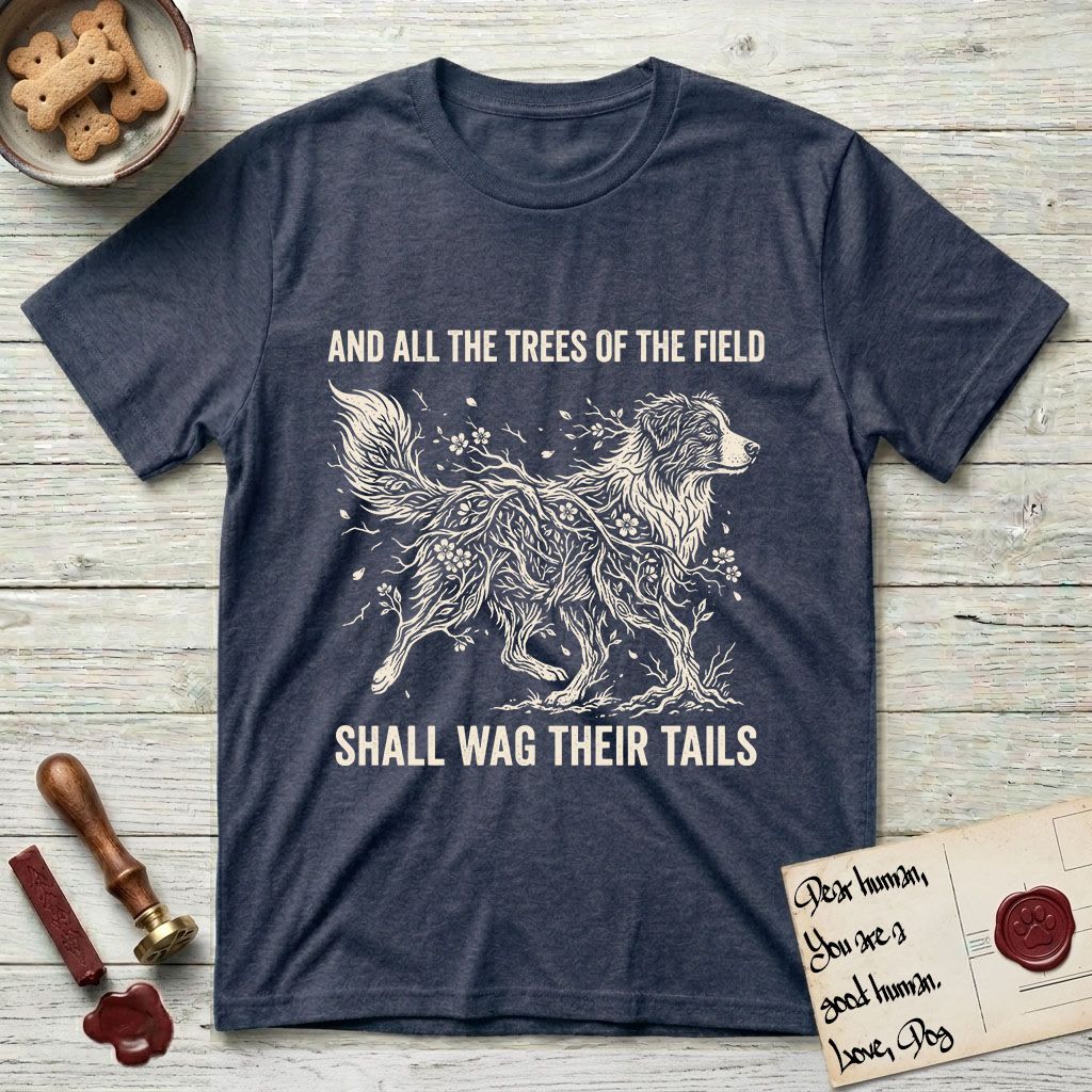Trees of the Field Australian Shepherd T-Shirt flat lay in Heather Navy, featuring a vintage woodcut illustration of an Australian Shepherd formed of flowering cherry branches, mid-stride, with the words And All the Trees of the Field Shall Wag Their Tails.